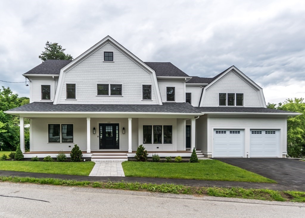 50 Nardone Road Needham, MA 02492 - Photo 1 of 37 a front view of a house with a yard and garage