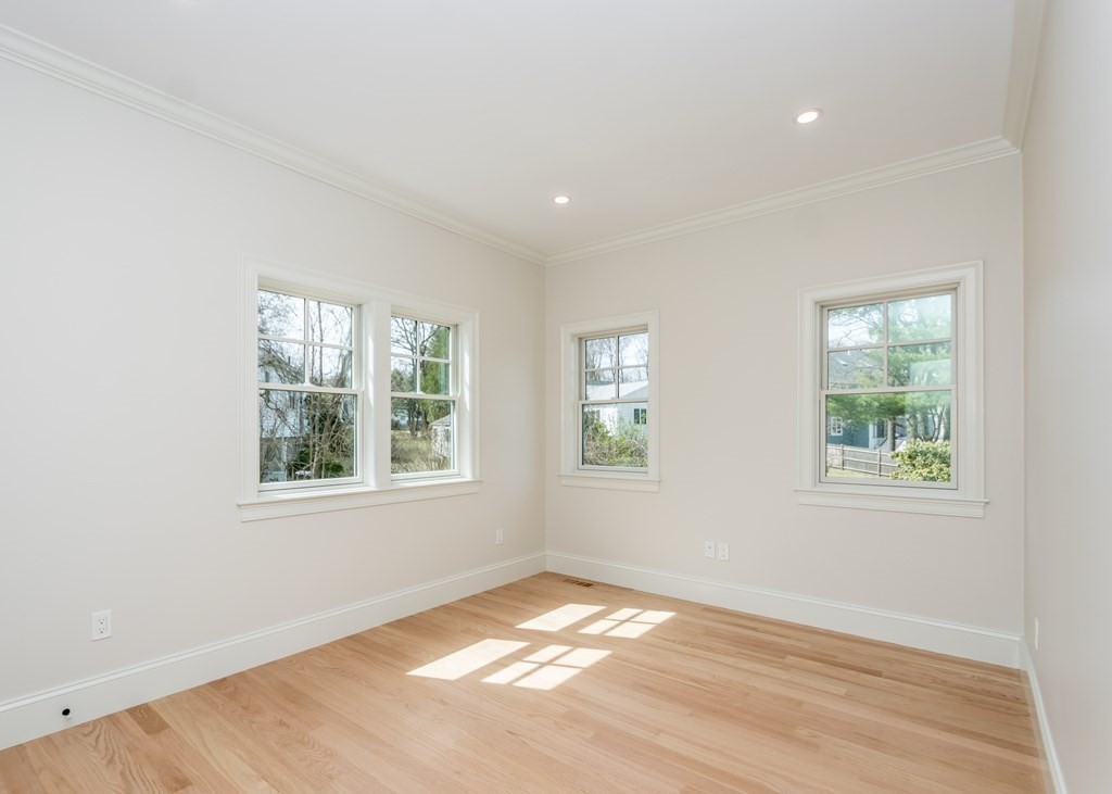 50 Nardone Road Needham, MA 02492 - Photo 17 of 37 an empty room with wooden floor and windows
