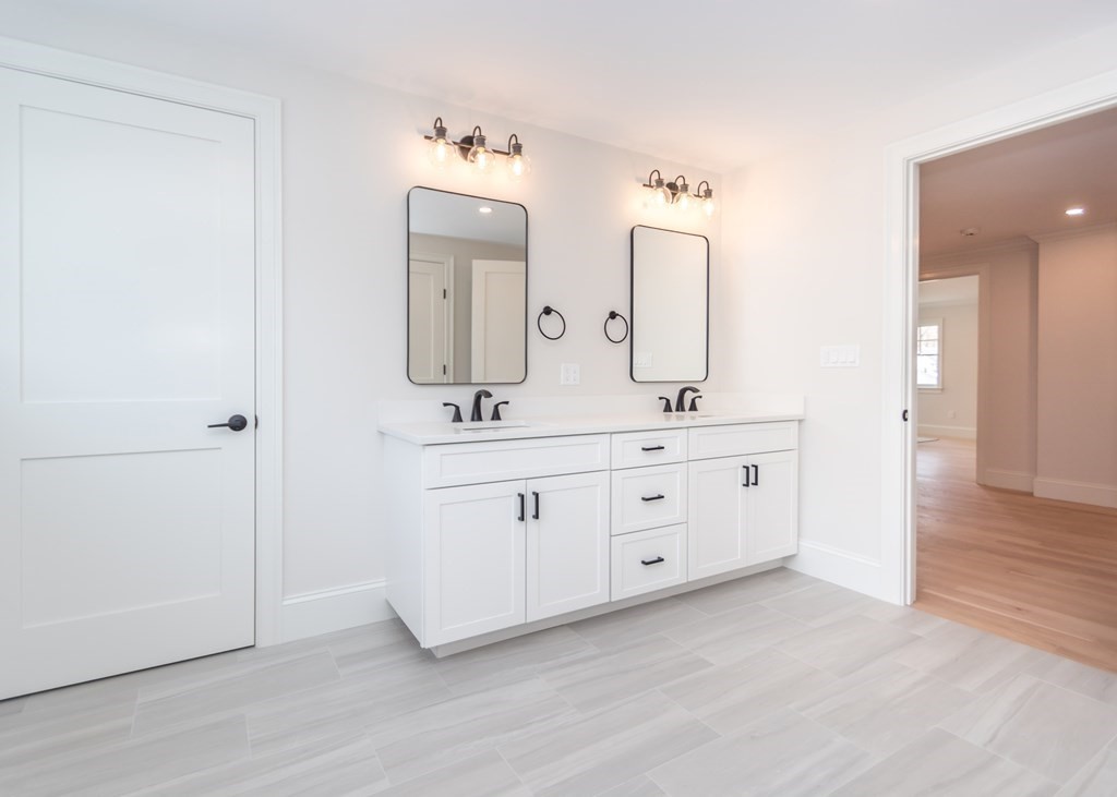 50 Nardone Road Needham, MA 02492 - Photo 20 of 37 a spacious bathroom with double vanity a mirror and a shower