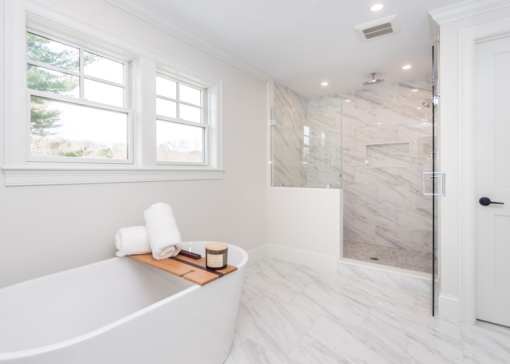 50 Nardone Road Needham, MA 02492 - Photo 21 of 37 a bathroom with a tub sink and a mirror