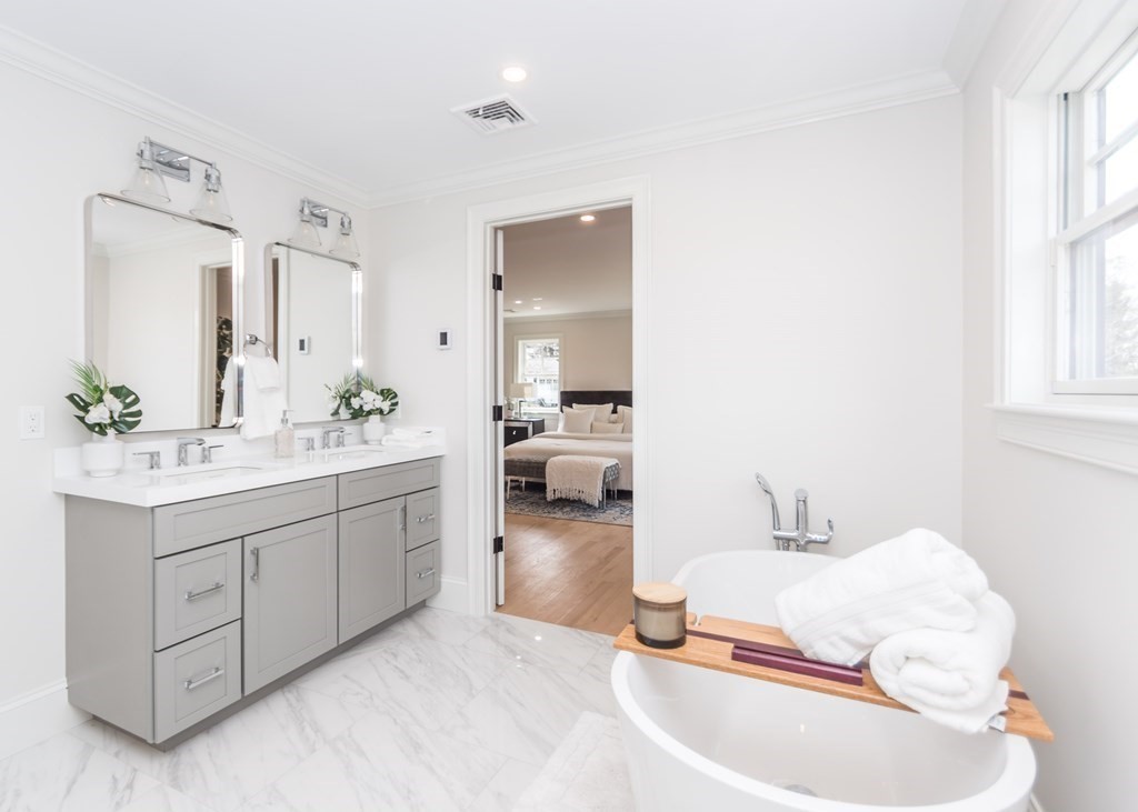 50 Nardone Road Needham, MA 02492 - Photo 22 of 37 a en suite bathroom with a double vanity sink and a mirror