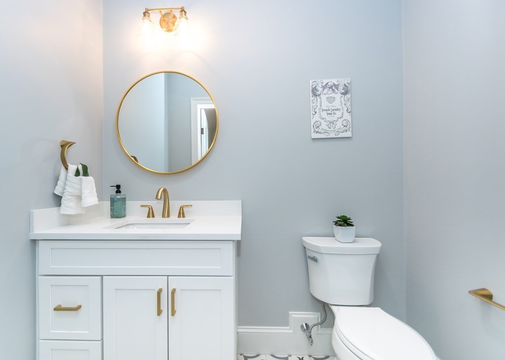 50 Nardone Road Needham, MA 02492 - Photo 23 of 37 a bathroom with a toilet sink and mirror