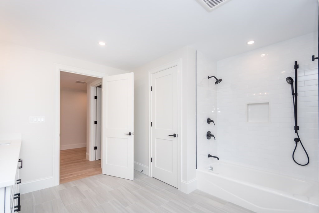 50 Nardone Road Needham, MA 02492 - Photo 25 of 37 a bathroom with a shower and a glass door