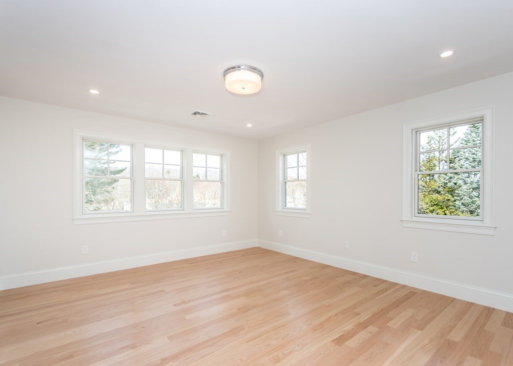 50 Nardone Road Needham, MA 02492 - Photo 27 of 37 a view of empty room with wooden floor and fan