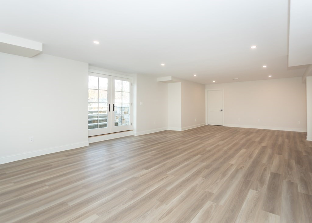 50 Nardone Road Needham, MA 02492 - Photo 30 of 37 an empty room with wooden floor and windows