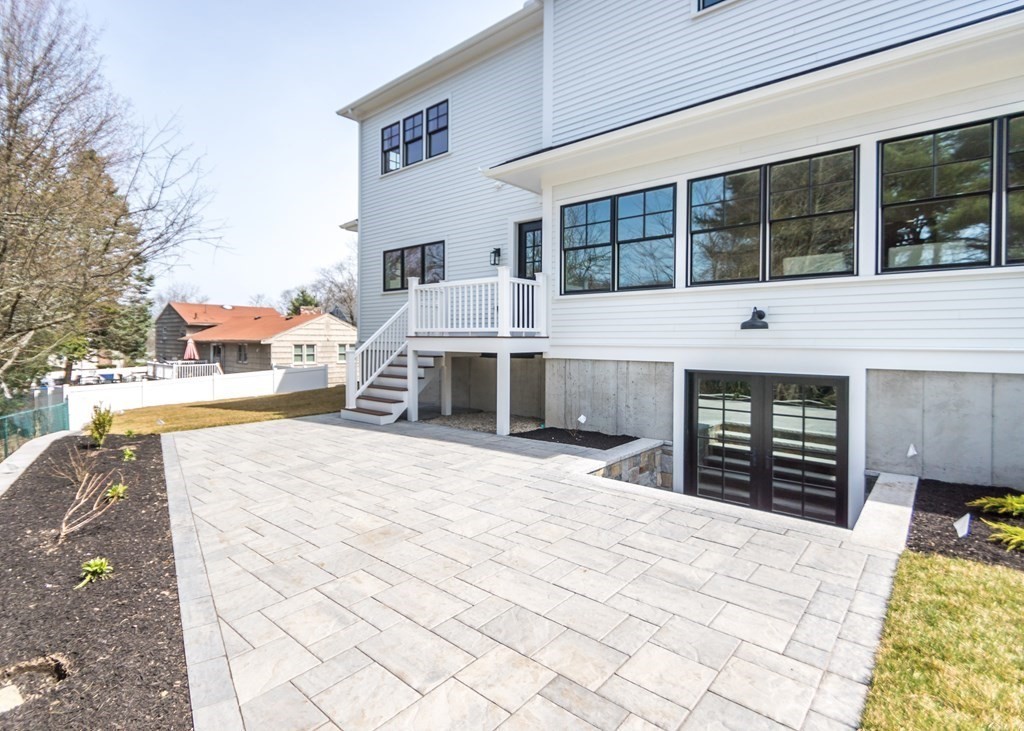 50 Nardone Road Needham, MA 02492 - Photo 33 of 37 a front view of a house with a yard