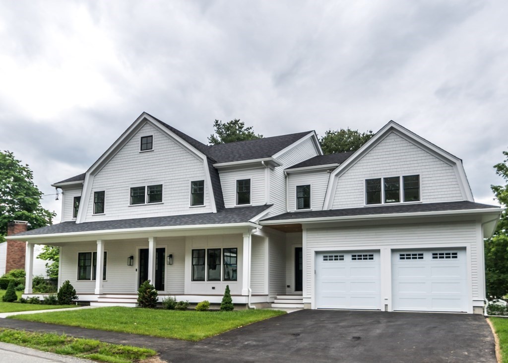 50 Nardone Road Needham, MA 02492 - Photo 37 of 37 a view of a white house with large windows and a yard