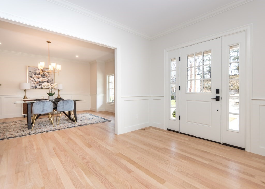 50 Nardone Road Needham, MA 02492 - Photo 5 of 37 a view of a livingroom with a dinning area wooden floor kitchen view and a refrigerator