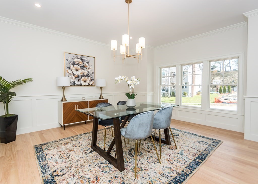 50 Nardone Road Needham, MA 02492 - Photo 6 of 37 a dining room with wooden floor a chandelier a wooden table and chairs