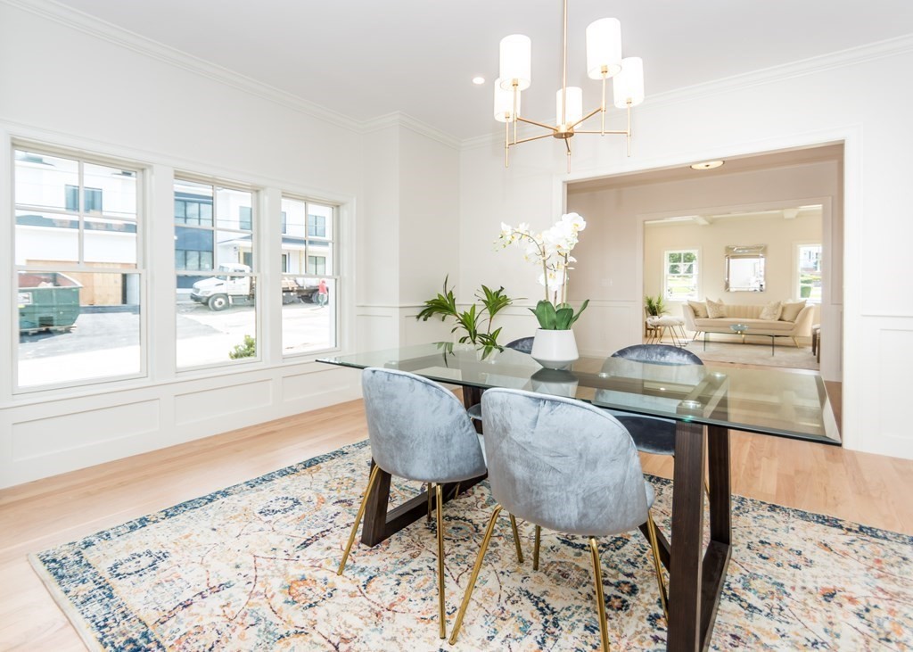 50 Nardone Road Needham, MA 02492 - Photo 7 of 37 a view of a dining room with furniture wooden floor and a chandelier