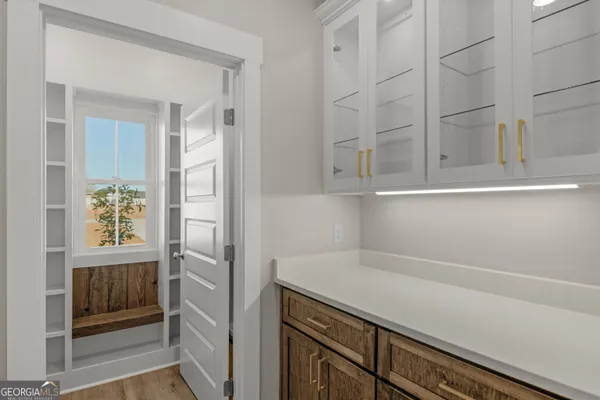 a kitchen with a fridge and a window