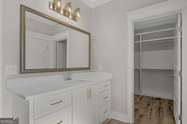 a bathroom with a sink and a mirror