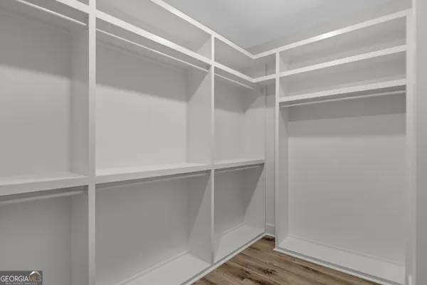 a view of an empty walk in closet