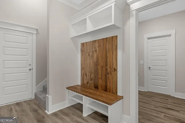 a view of wooden floor and chair in a room