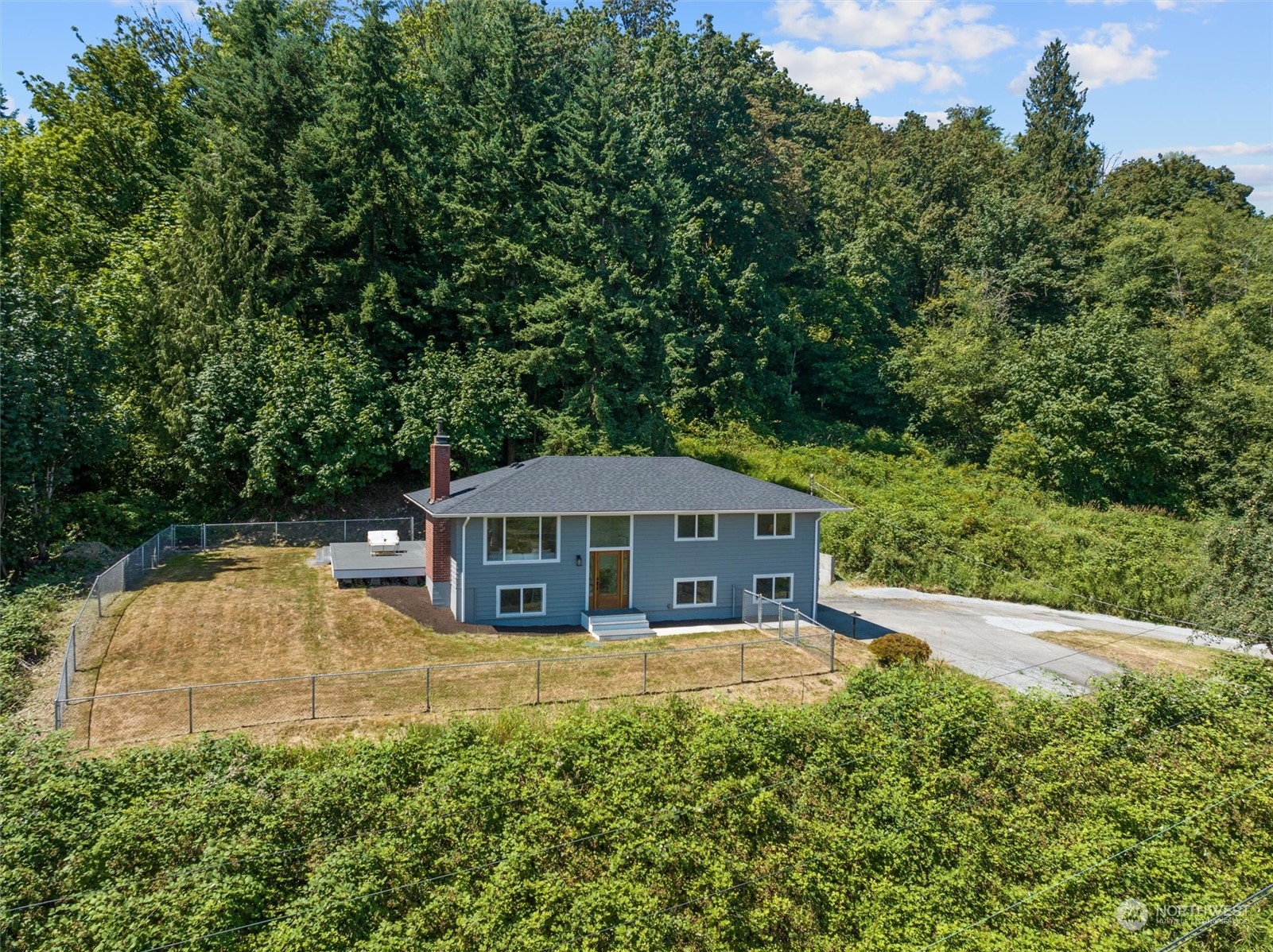 6314 Larimer Road Everett, WA 98208 - Photo 1 of 40 a house with trees in the background