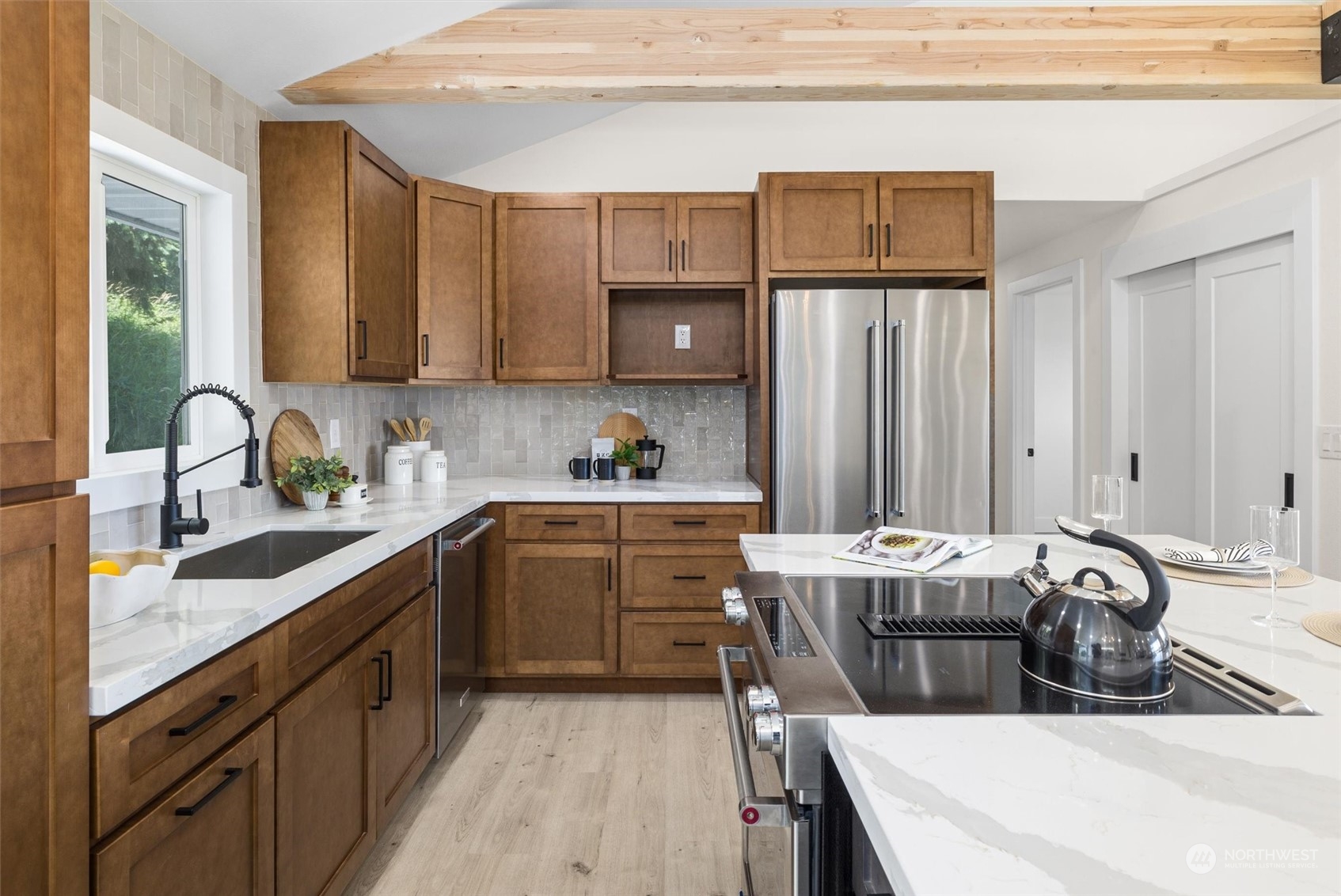 6314 Larimer Road Everett, WA 98208 - Photo 12 of 40 a kitchen with a sink a stove and cabinets