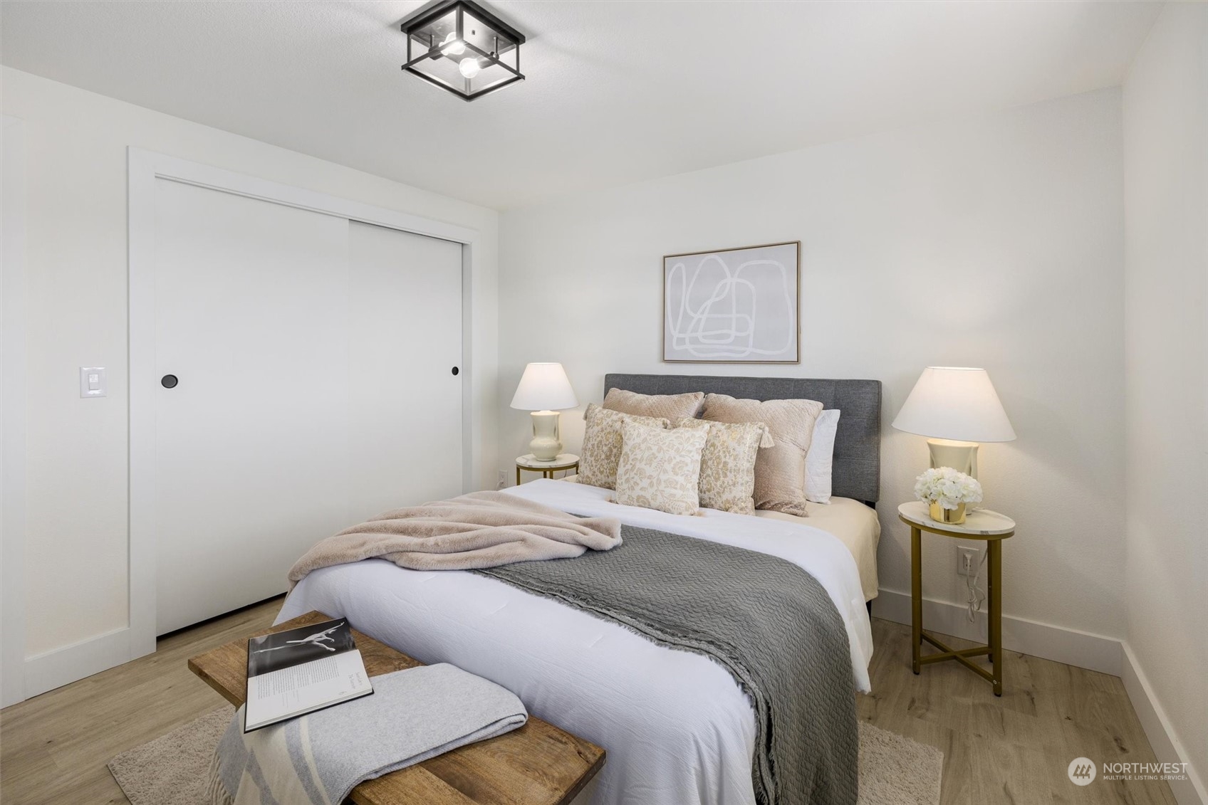 6314 Larimer Road Everett, WA 98208 - Photo 19 of 40 a bed room with a bed and a lamp