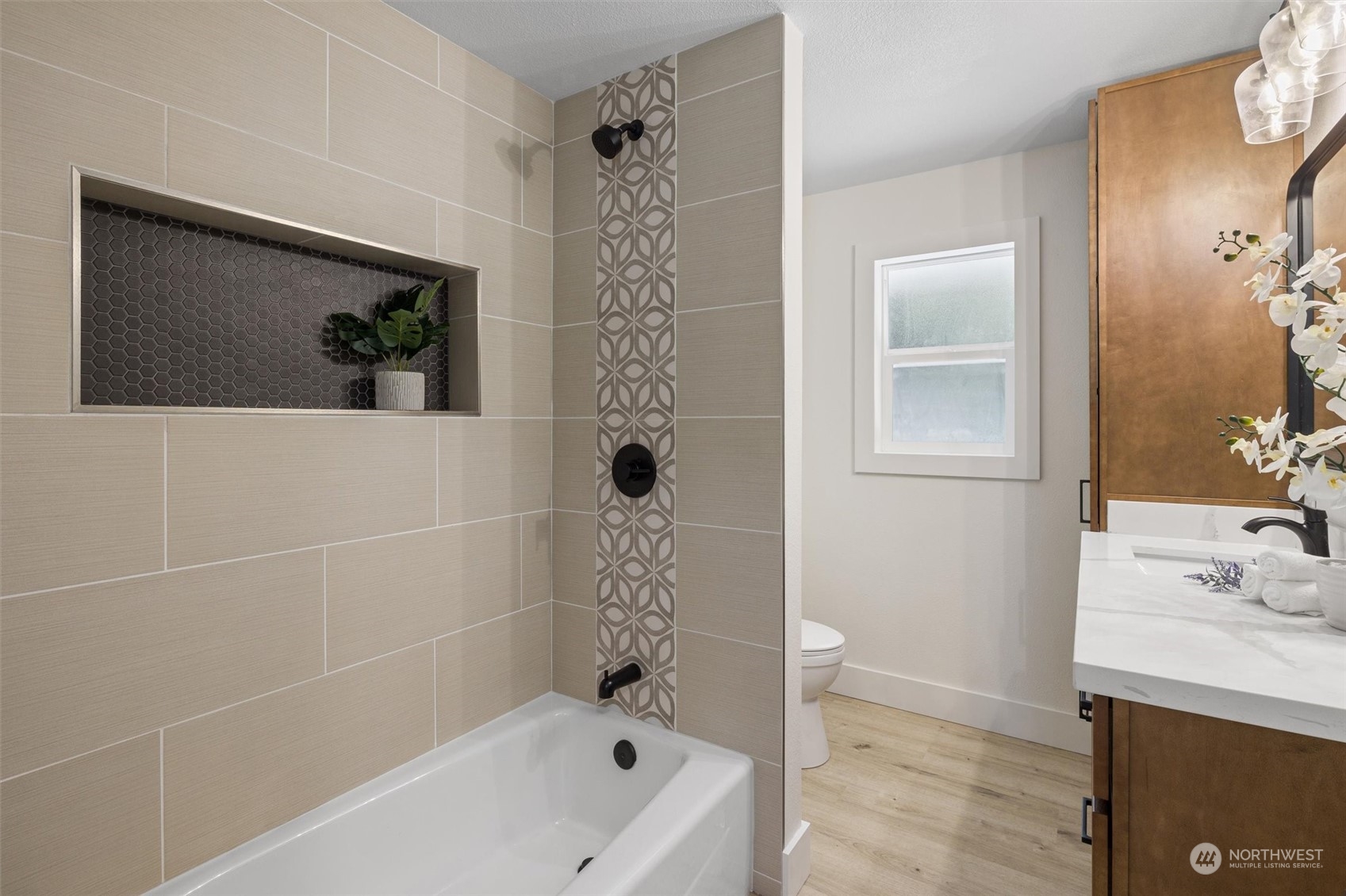 6314 Larimer Road Everett, WA 98208 - Photo 20 of 40 a bathroom with a tub a sink and glass door shower