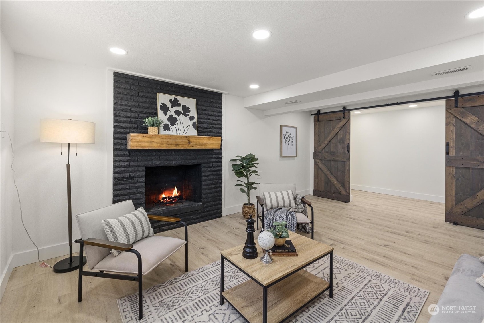6314 Larimer Road Everett, WA 98208 - Photo 25 of 40 a living room with furniture and a fireplace