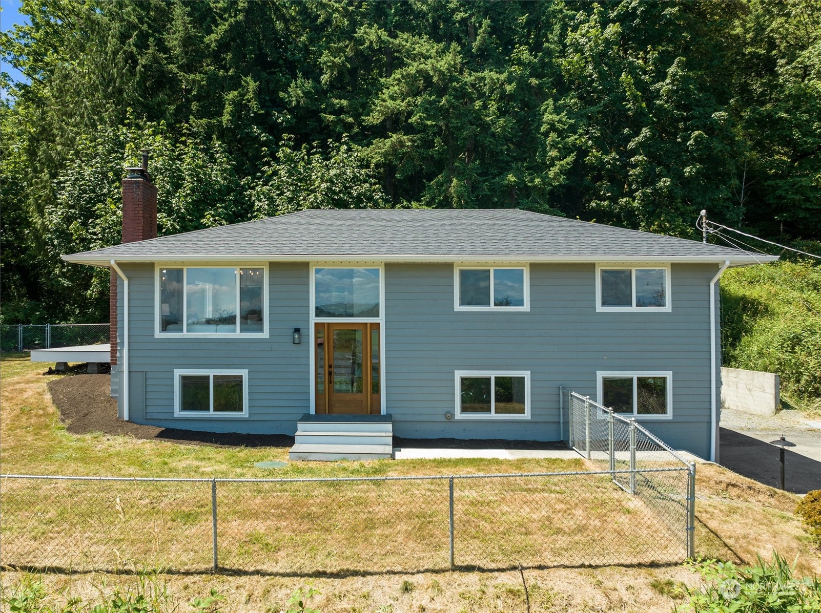 6314 Larimer Road Everett, WA 98208 - Photo 3 of 40 a house that has a tree in front of it