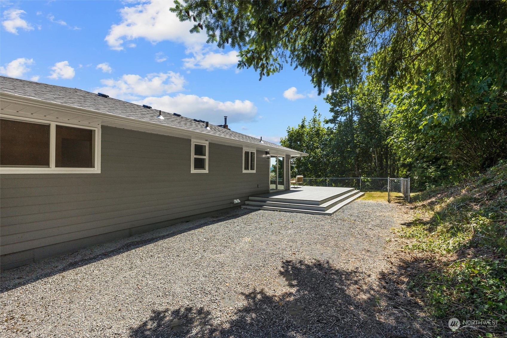 6314 Larimer Road Everett, WA 98208 - Photo 31 of 40 a view of a backyard with a large tree