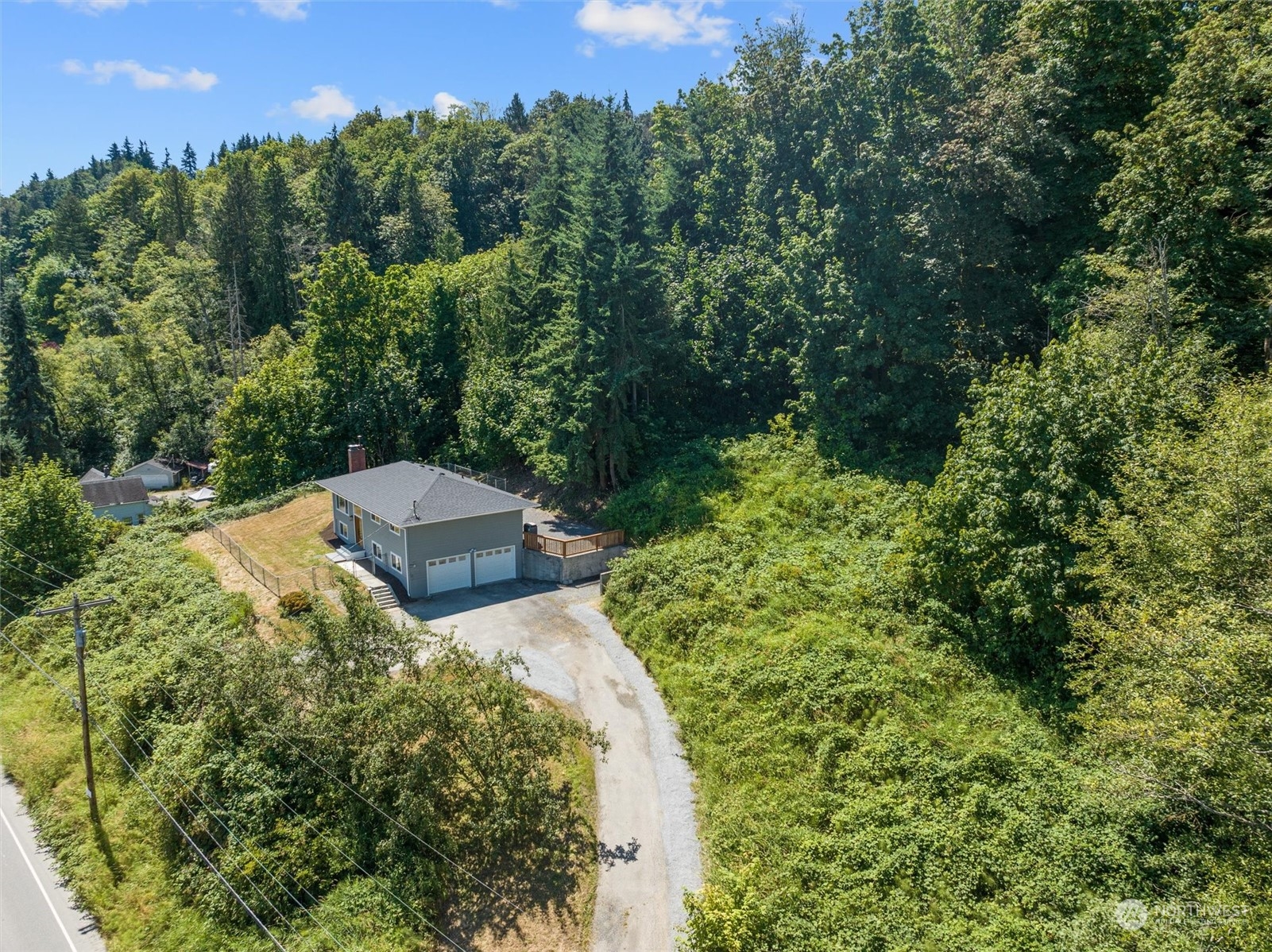 6314 Larimer Road Everett, WA 98208 - Photo 34 of 40 a view of a garden with large trees