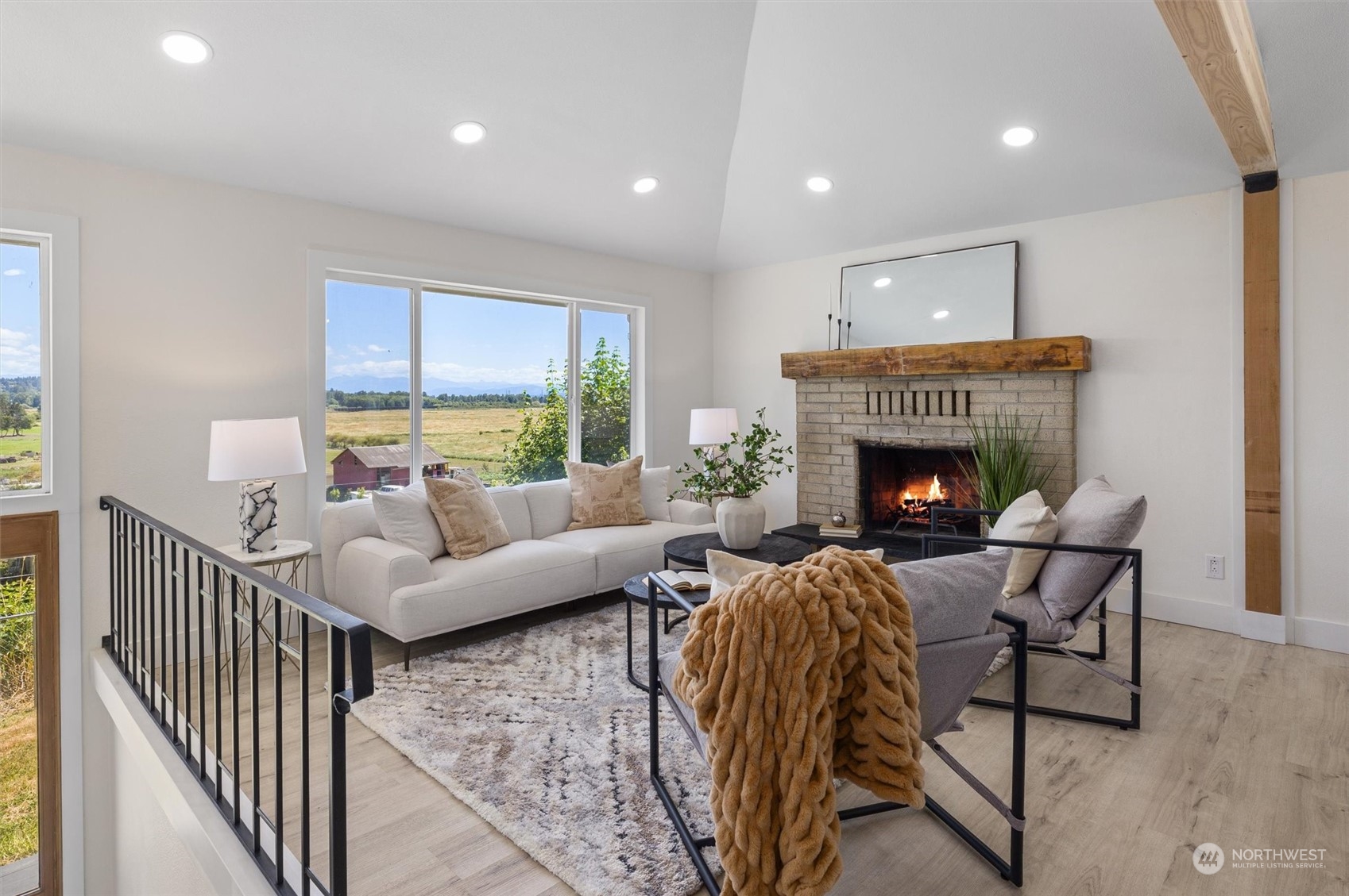 6314 Larimer Road Everett, WA 98208 - Photo 8 of 40 a living room with furniture and a fireplace