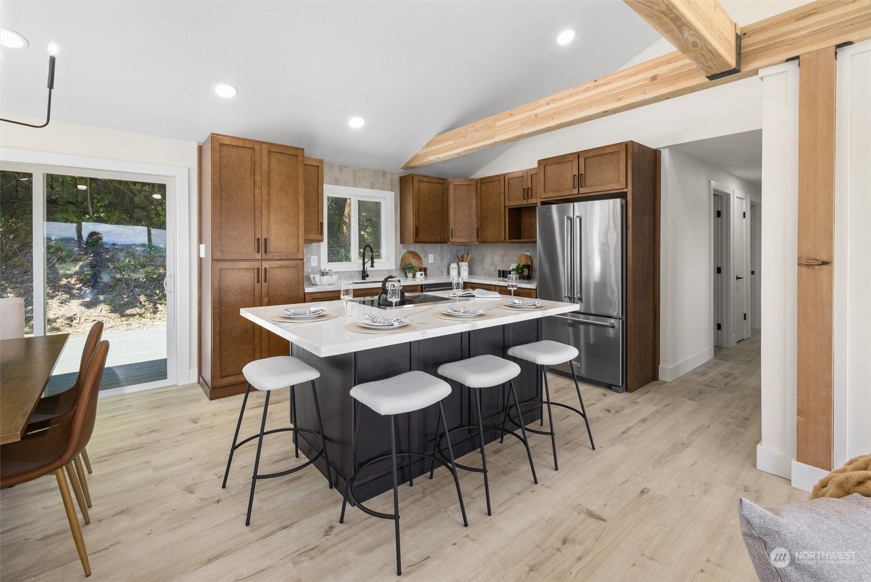 6314 Larimer Road Everett, WA 98208 - Photo 10 of 40 a kitchen with a dining table chairs and refrigerator