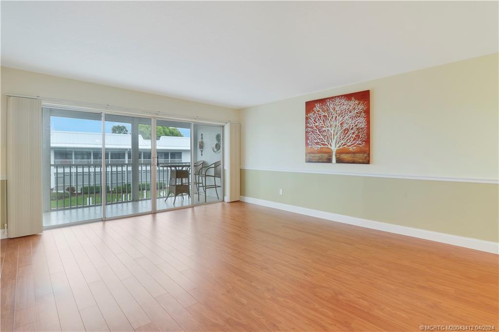 1864 Southwest Palm City Road, Unit 202 Stuart, FL 34994 - Photo 6 of 29 Features chair rail detail