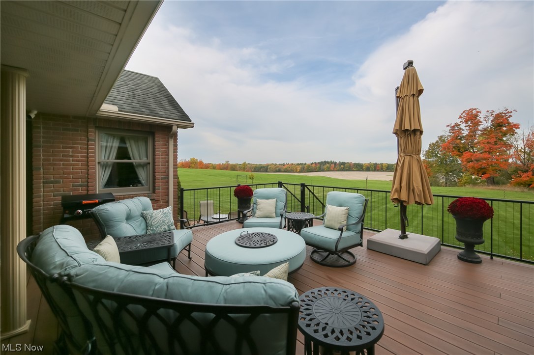 215 Georgetown-Damascus Road Beloit, OH 44609 - Photo 29 of 37 Wooden terrace featuring an outdoor living space with a fire pit
