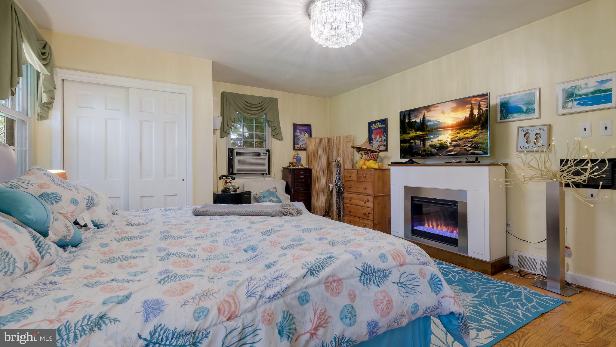 1591 Middletown Road Glen Mills, PA 19342 - Photo 20 of 55 a bedroom with a bed and a flat screen tv