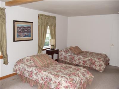 107 Lincoln Road Hyannis, MA 02601 - Photo 11 of 29 a bedroom with two beds and a window