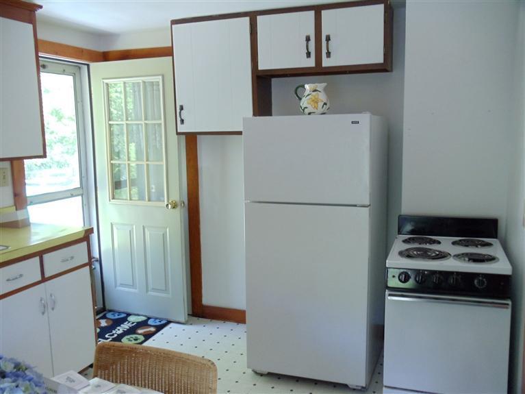 107 Lincoln Road Hyannis, MA 02601 - Photo 15 of 29 a kitchen with a refrigerator and a sink