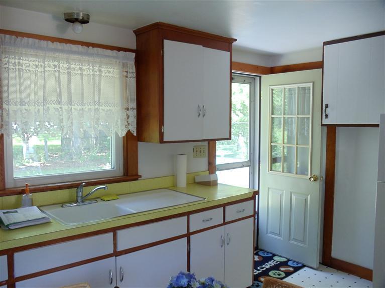 107 Lincoln Road Hyannis, MA 02601 - Photo 16 of 29 a kitchen with a sink and a window