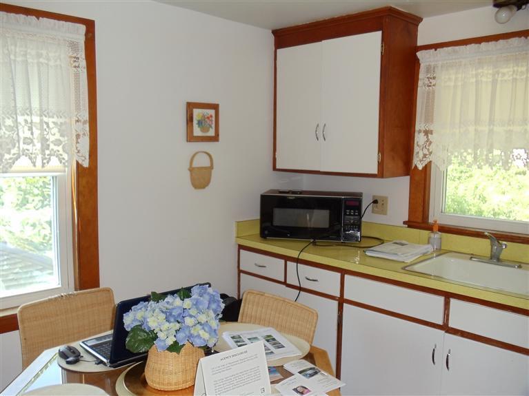 107 Lincoln Road Hyannis, MA 02601 - Photo 17 of 29 a kitchen with a sink and a window