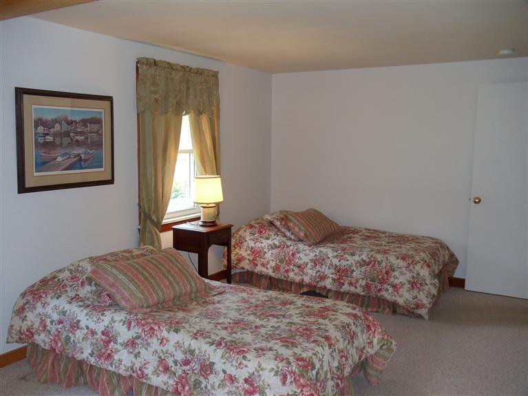107 Lincoln Road Hyannis, MA 02601 - Photo 25 of 29 a bedroom with a bed and a window