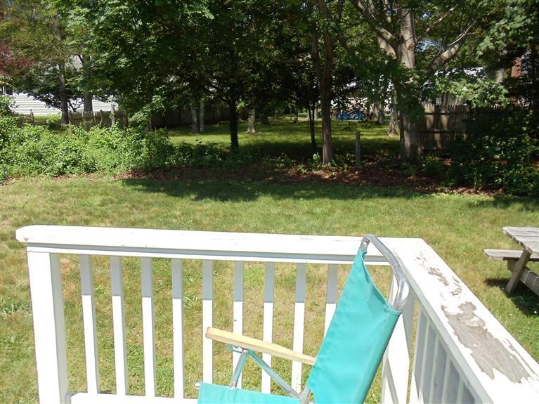 107 Lincoln Road Hyannis, MA 02601 - Photo 27 of 29 a view of a backyard with a garden and trees