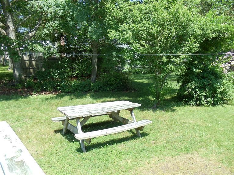 107 Lincoln Road Hyannis, MA 02601 - Photo 28 of 29 a view of a backyard with chairs
