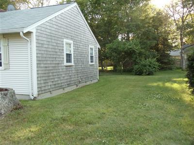 107 Lincoln Road Hyannis, MA 02601 - Photo 4 of 29 a view of a backyard with a garden