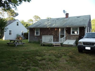 107 Lincoln Road Hyannis, MA 02601 - Photo 5 of 29 a house view with a sitting space and garden