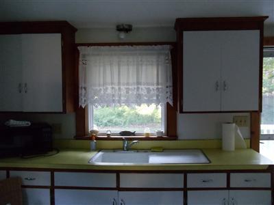 107 Lincoln Road Hyannis, MA 02601 - Photo 6 of 29 a view of a sink with an outdoor space