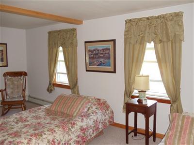 107 Lincoln Road Hyannis, MA 02601 - Photo 10 of 29 a bedroom with a bed and a window