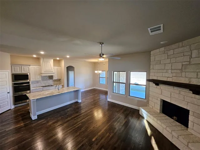 an empty room with windows and entrance