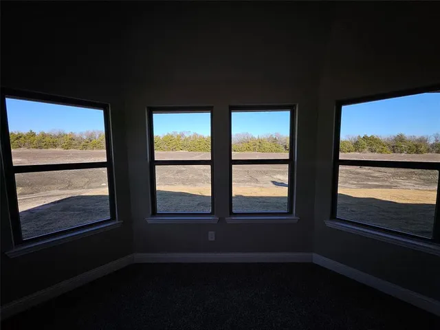 a spacious bathroom with a tub sink and mirror