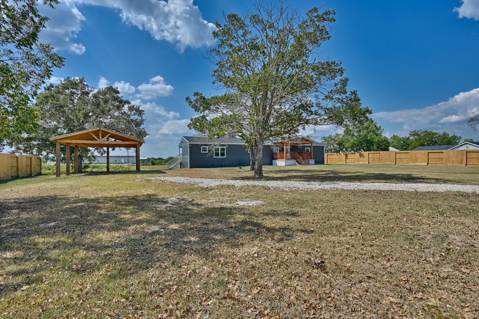 9137 Conner Road Washington, TX 77880 - Photo 21 of 44 a front view of a house with a yard