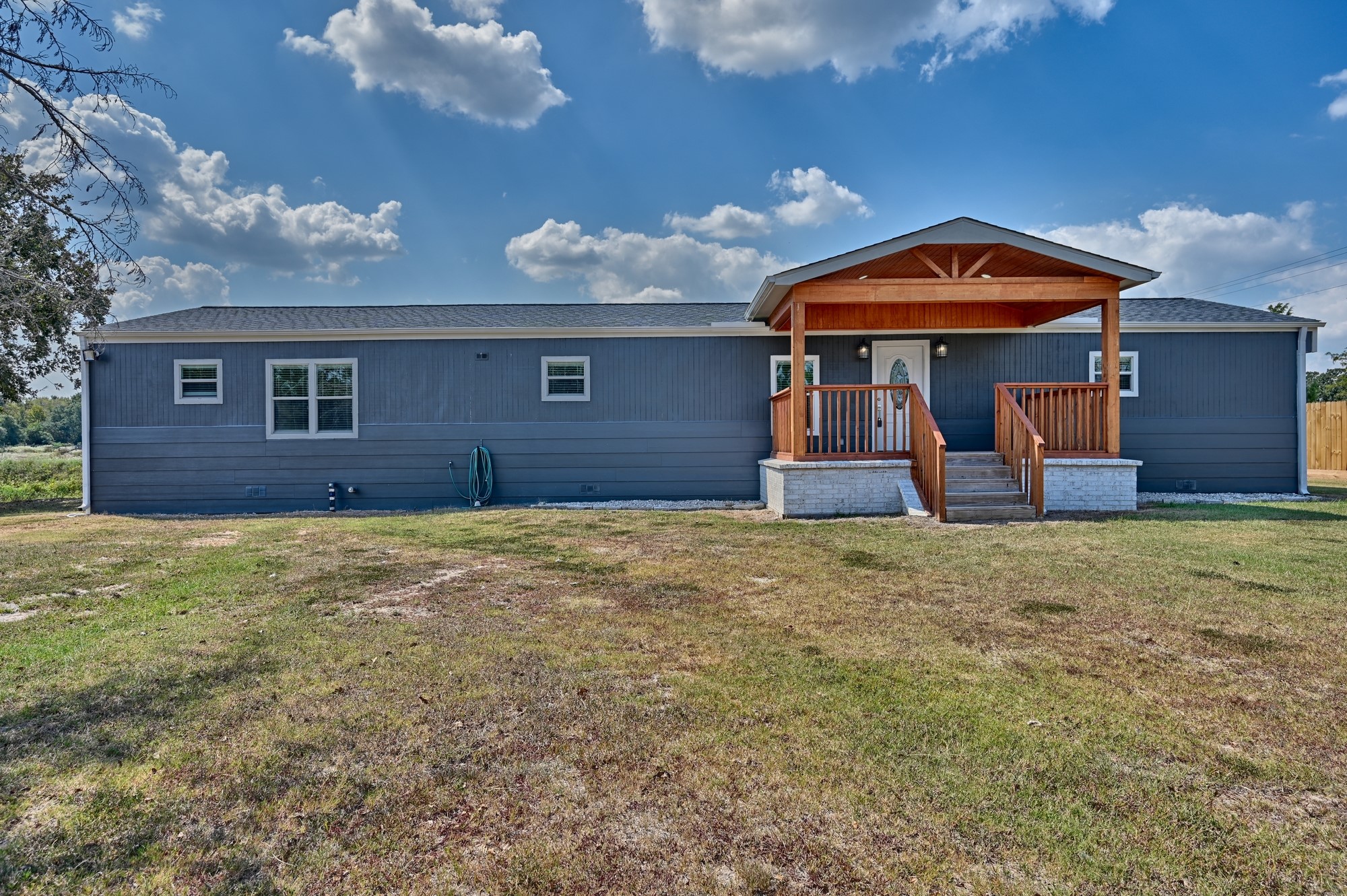 9137 Conner Road Washington, TX 77880 - Photo 25 of 44 a front view of a house with garden