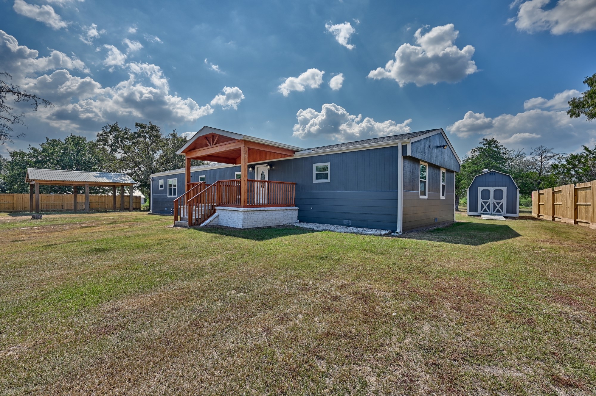 9137 Conner Road Washington, TX 77880 - Photo 29 of 44 a front view of a house with a yard and garage
