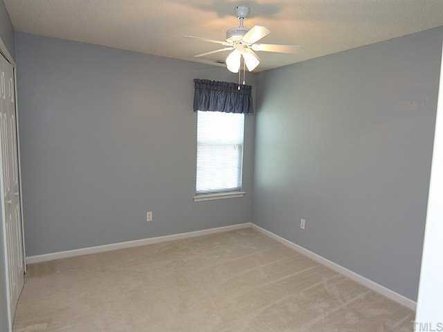 5012 Gable Ridge Drive Durham, NC 27713 - Photo 7 of 12 an empty room with a window