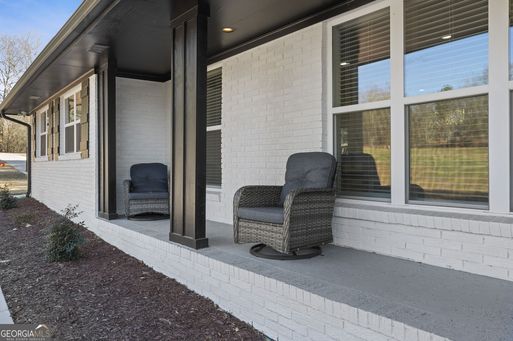 2604 Flat Shoals Road Southwest Conyers, GA 30094 - Photo 2 of 44 a view of backyard with furniture and a window