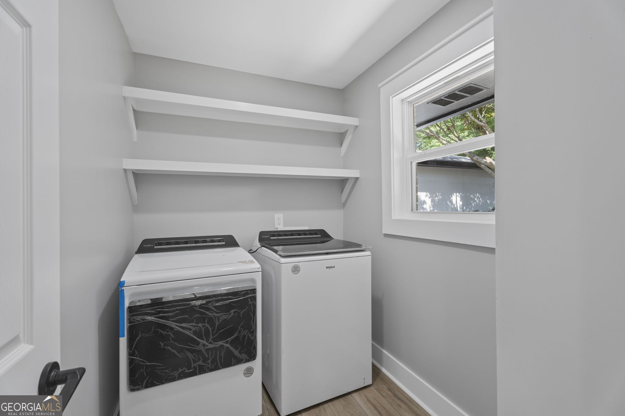 2604 Flat Shoals Road Southwest Conyers, GA 30094 - Photo 22 of 44 a utility room with dryer and washer